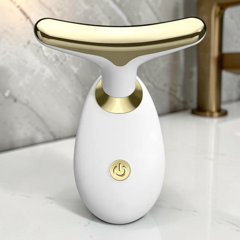 Dispositivo de masaje facial sónico zafiropulse PERENNE Sonic Lift en color blanco y dorado para reafirmar la piel