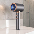 Secador de pelo zafiropulse PERENNE Aero-Glow Therapy en gris mate con detalles en cobre y diseño ergonómico en T